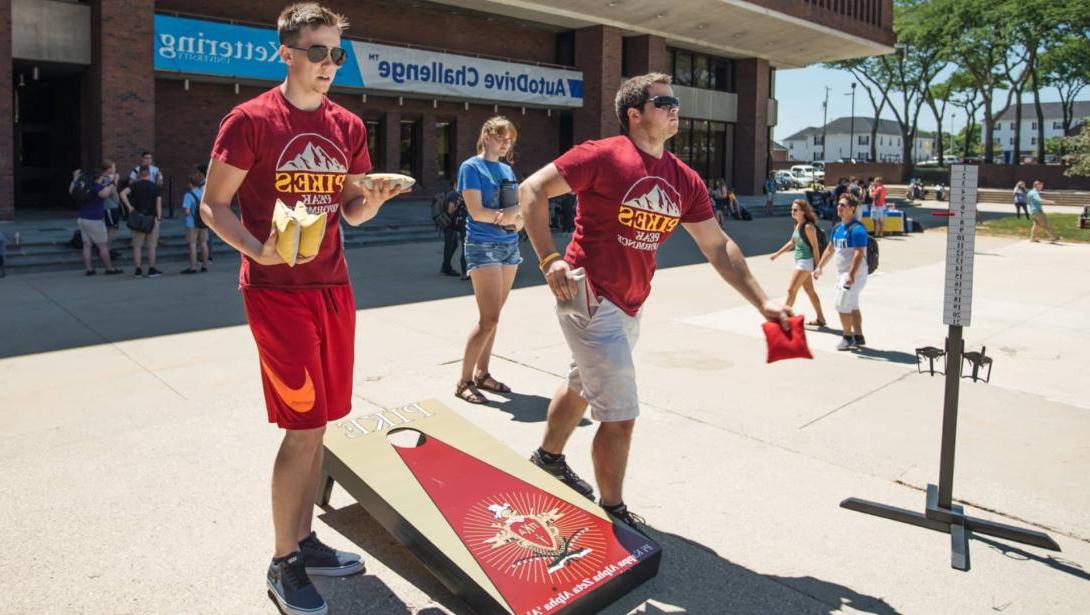 Pikes fraternity members play cornhole during Rush Week activities.